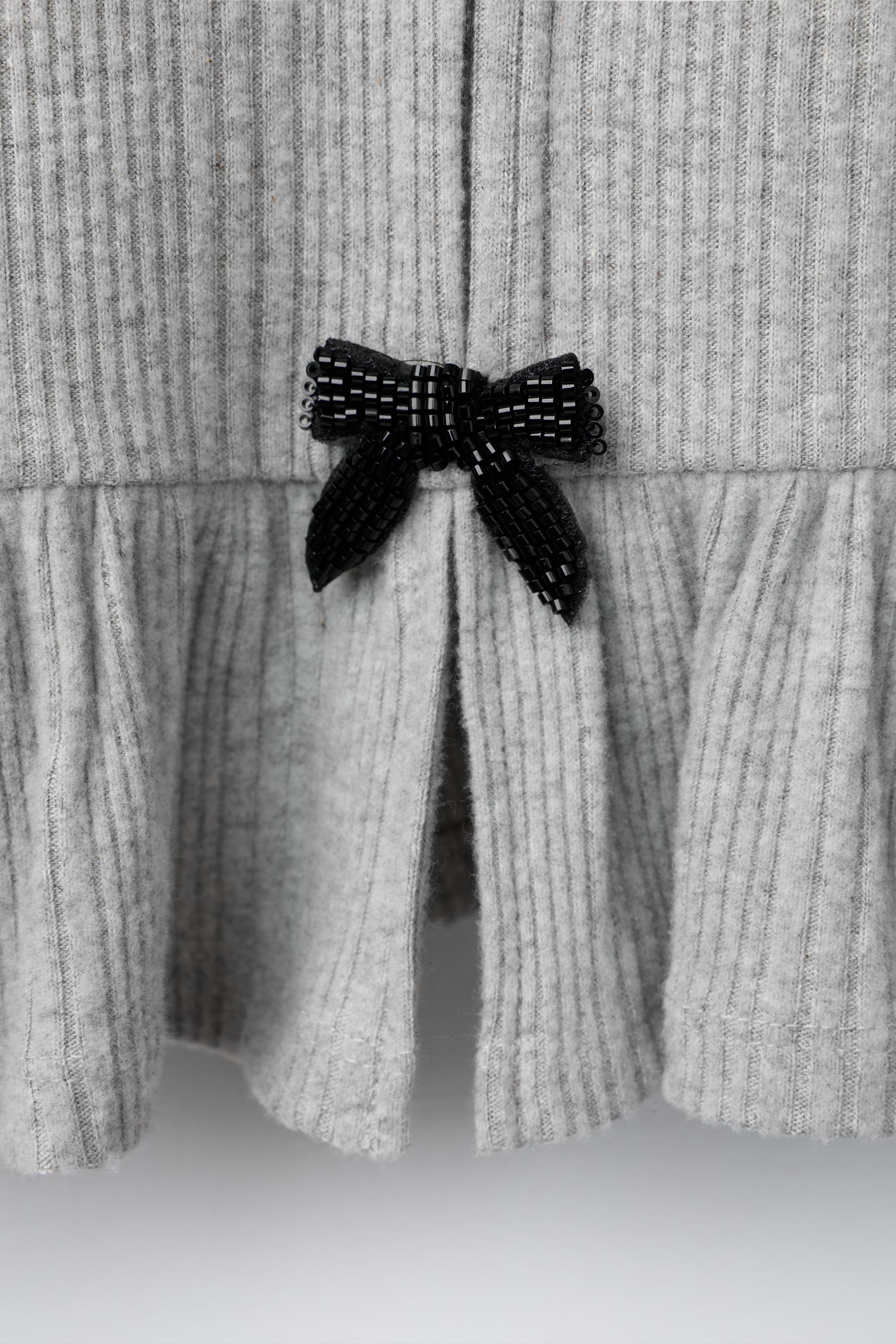 HAUT CÔTELÉ SOFT TOUCH À LACETS